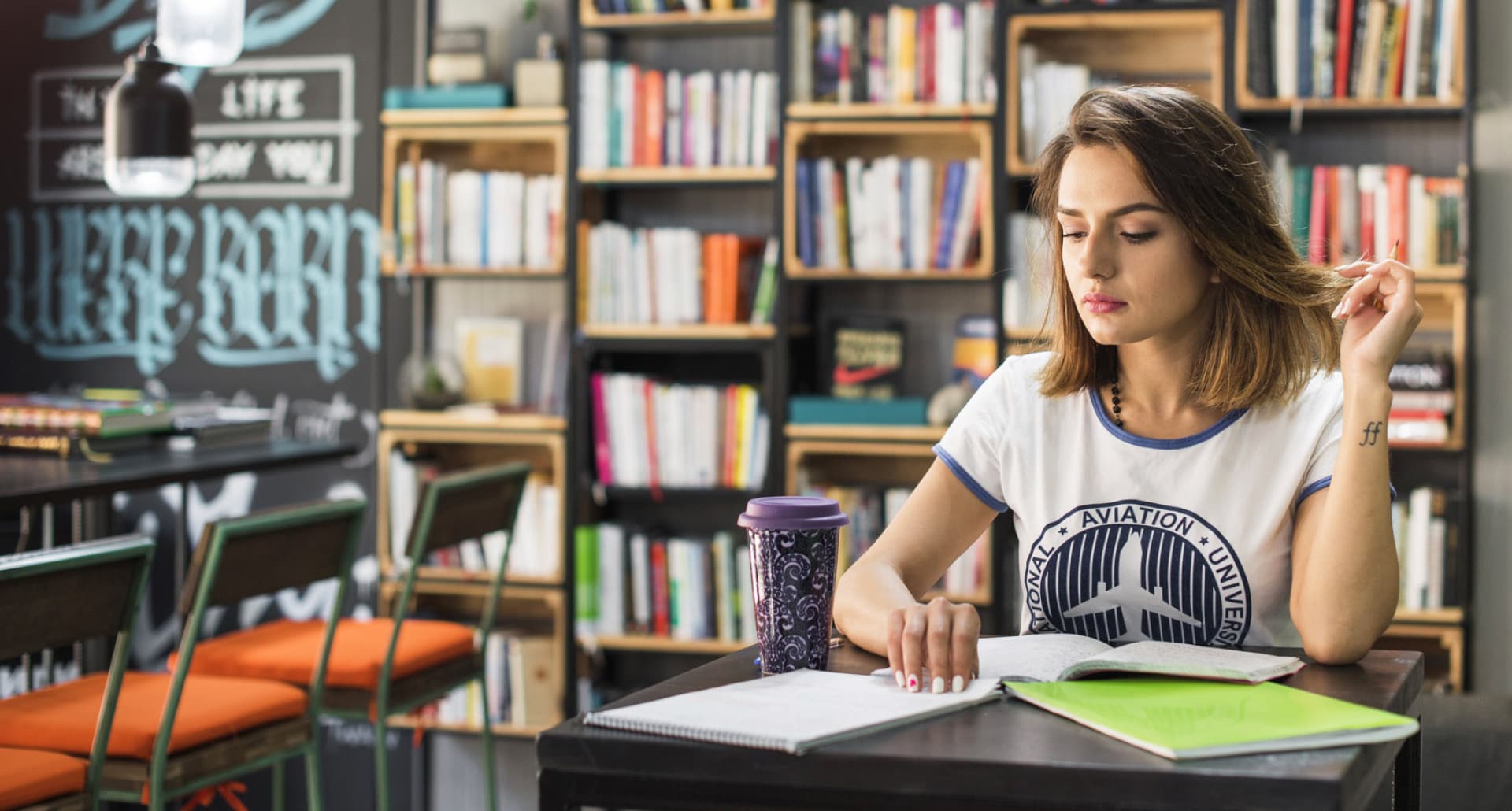 A CSMP IAS aspirant studying at a library desk